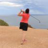 Raelee hitting over the water hazard